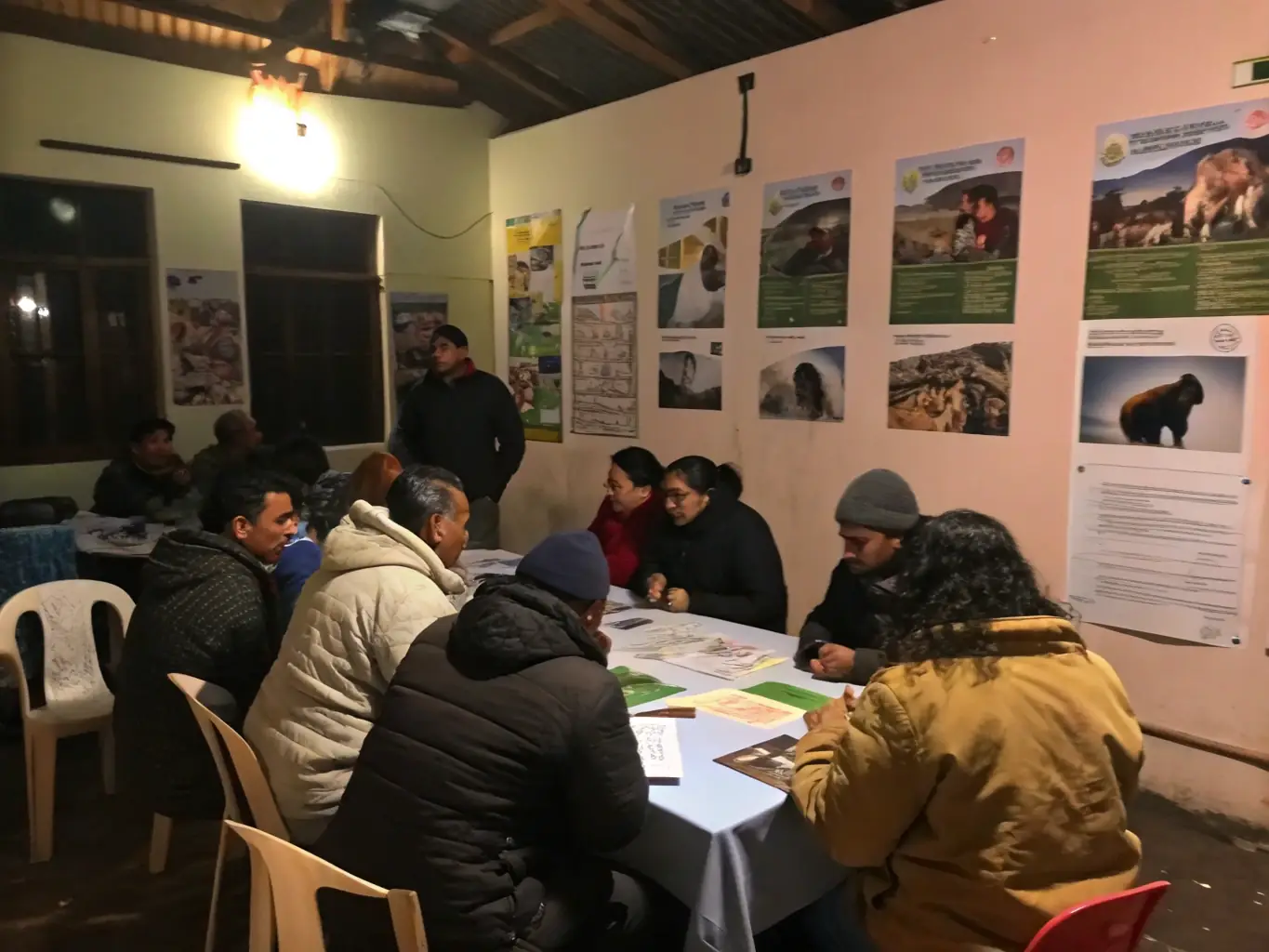 A photo of a workshop where members are learning about wildlife conservation and sustainable hunting practices.
